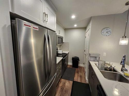 233 Savanna Ne, Calgary, AB - Indoor Photo Showing Kitchen With Stainless Steel Kitchen With Double Sink With Upgraded Kitchen