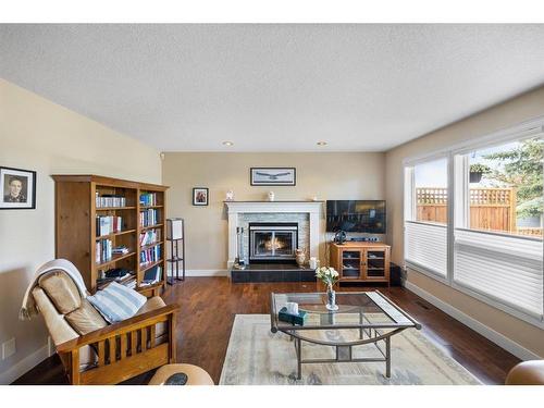 235 Woodfield Road Sw, Calgary, AB - Indoor Photo Showing Living Room With Fireplace