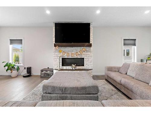 15 Keown Close, Olds, AB - Indoor Photo Showing Living Room With Fireplace