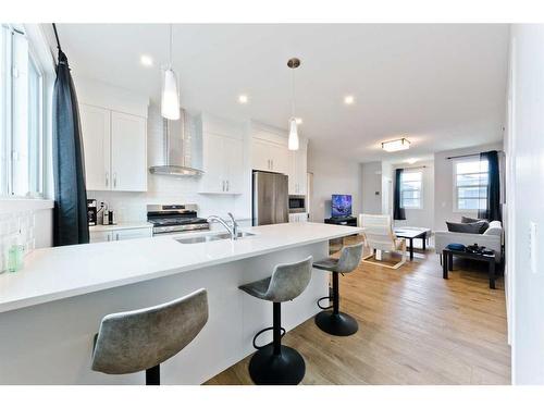 25 Lucas Rise Nw, Calgary, AB - Indoor Photo Showing Kitchen With Double Sink With Upgraded Kitchen