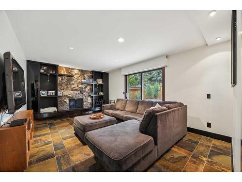 260 Pump Hill Crescent Sw, Calgary, AB - Indoor Photo Showing Living Room With Fireplace