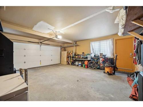 260 Pump Hill Crescent Sw, Calgary, AB - Indoor Photo Showing Garage