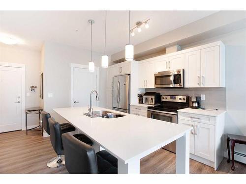 215-20 Walgrove Walk Se, Calgary, AB - Indoor Photo Showing Kitchen With Double Sink With Upgraded Kitchen