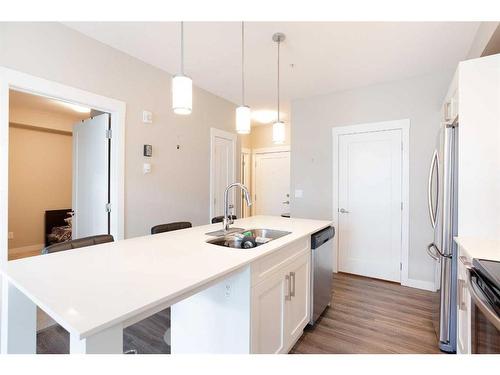 215-20 Walgrove Walk Se, Calgary, AB - Indoor Photo Showing Kitchen With Double Sink With Upgraded Kitchen