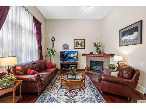 361 Elgin Way Se, Calgary, AB - Indoor Photo Showing Living Room With Fireplace