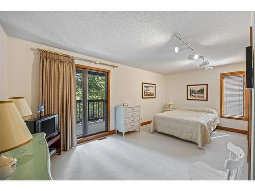 672 Coach Grove Road Sw, Calgary, AB - Indoor Photo Showing Bedroom