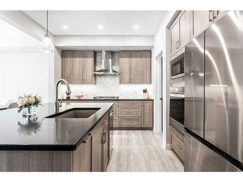 113 Amblehurst Green Nw, Calgary, AB - Indoor Photo Showing Kitchen With Upgraded Kitchen