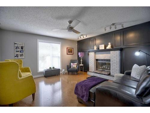 199 Riverside Close Se, Calgary, AB - Indoor Photo Showing Living Room With Fireplace