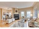 402 Garrison Square Sw, Calgary, AB  - Indoor Photo Showing Living Room With Fireplace 