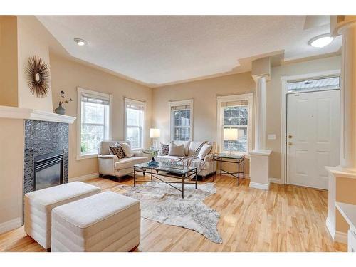 402 Garrison Square Sw, Calgary, AB - Indoor Photo Showing Living Room With Fireplace