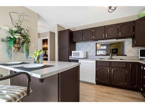 907-3240 66 Avenue Sw, Calgary, AB - Indoor Photo Showing Kitchen With Double Sink