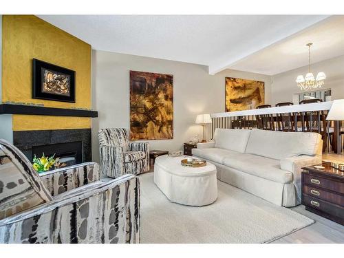 907-3240 66 Avenue Sw, Calgary, AB - Indoor Photo Showing Living Room With Fireplace