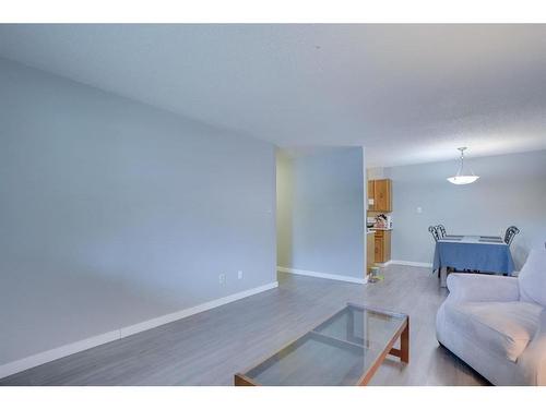 #104-617 56 Avenue Sw, Calgary, AB - Indoor Photo Showing Living Room