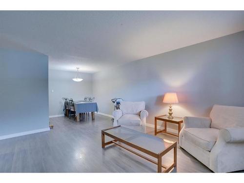 #104-617 56 Avenue Sw, Calgary, AB - Indoor Photo Showing Living Room