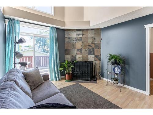 30 River Rock Way Se, Calgary, AB - Indoor With Fireplace