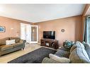 30 River Rock Way Se, Calgary, AB  - Indoor Photo Showing Living Room 