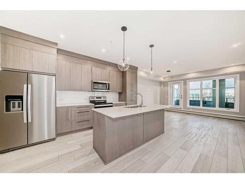 2201-681 Savanna Boulevard Ne, Calgary, AB - Indoor Photo Showing Kitchen With Stainless Steel Kitchen With Upgraded Kitchen