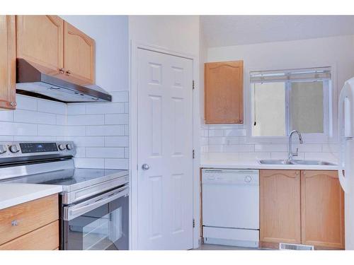 83 Saddlemont Manor Ne, Calgary, AB - Indoor Photo Showing Kitchen With Double Sink