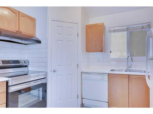 83 Saddlemont Manor Ne, Calgary, AB - Indoor Photo Showing Kitchen With Double Sink