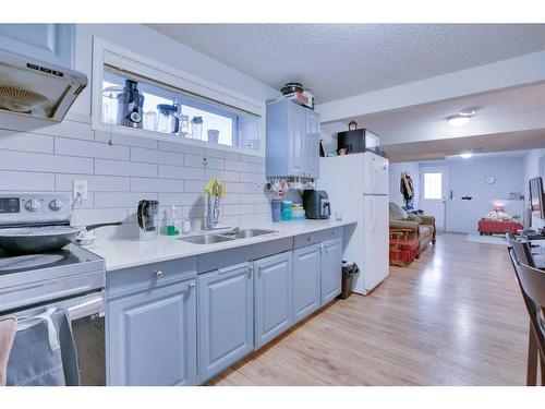 83 Saddlemont Manor Ne, Calgary, AB - Indoor Photo Showing Kitchen With Double Sink