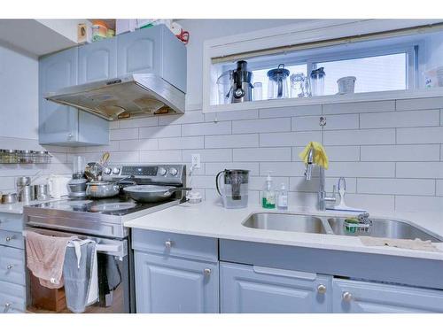 83 Saddlemont Manor Ne, Calgary, AB - Indoor Photo Showing Kitchen With Double Sink