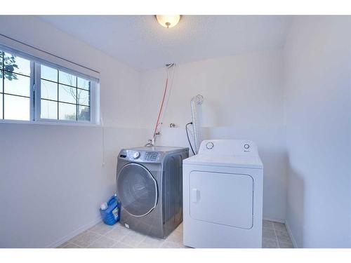 83 Saddlemont Manor Ne, Calgary, AB - Indoor Photo Showing Laundry Room