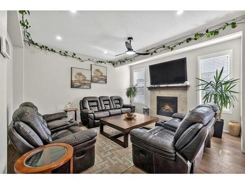317 Cornerstone Manor Ne, Calgary, AB - Indoor Photo Showing Living Room With Fireplace