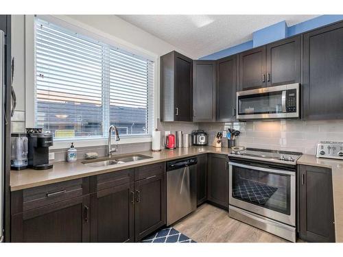 78 Livingston Gate Ne, Calgary, AB - Indoor Photo Showing Kitchen With Stainless Steel Kitchen With Double Sink