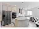 25 Carringham Heights Nw, Calgary, AB  - Indoor Photo Showing Kitchen With Upgraded Kitchen 
