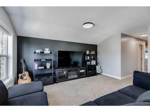 207 Cooperstown Lane Sw, Airdrie, AB - Indoor Photo Showing Living Room