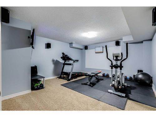 207 Cooperstown Lane Sw, Airdrie, AB - Indoor Photo Showing Gym Room