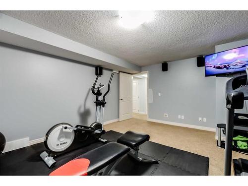 207 Cooperstown Lane Sw, Airdrie, AB - Indoor Photo Showing Gym Room