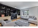 207 Cooperstown Lane Sw, Airdrie, AB  - Indoor Photo Showing Living Room With Fireplace 