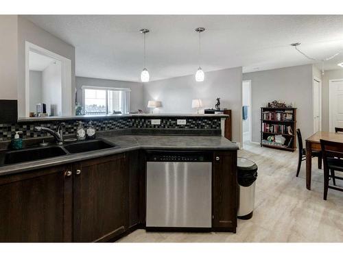 1429-8810 Royal Birch Boulevard Nw, Calgary, AB - Indoor Photo Showing Kitchen With Double Sink