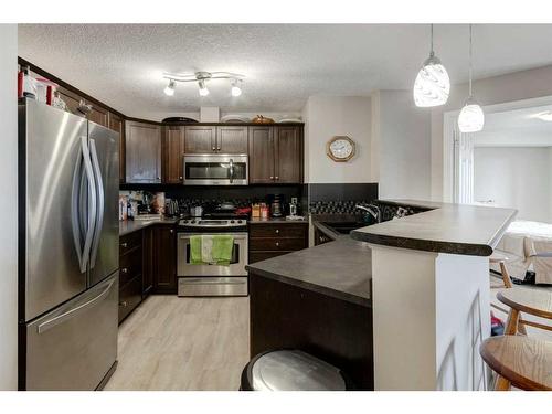 1429-8810 Royal Birch Boulevard Nw, Calgary, AB - Indoor Photo Showing Kitchen