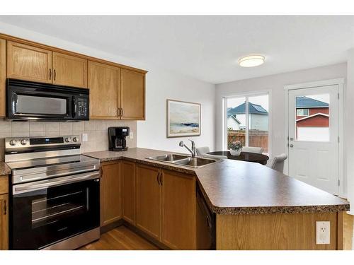 395 Silverado Drive Sw, Calgary, AB - Indoor Photo Showing Kitchen With Double Sink