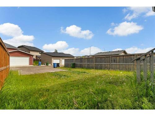 395 Silverado Drive Sw, Calgary, AB - Outdoor With Backyard