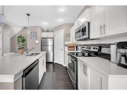 1907-881 Sage Valley Boulevard Nw, Calgary, AB - Indoor Photo Showing Kitchen With Double Sink With Upgraded Kitchen