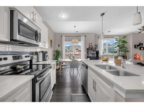 1907-881 Sage Valley Boulevard Nw, Calgary, AB - Indoor Photo Showing Kitchen With Double Sink With Upgraded Kitchen