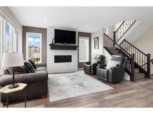 95 Silverado Crest Place Sw, Calgary, AB - Indoor Photo Showing Living Room With Fireplace