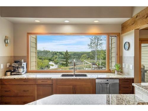 156 Toki Road, Rural Rocky View County, AB - Indoor Photo Showing Kitchen With Double Sink