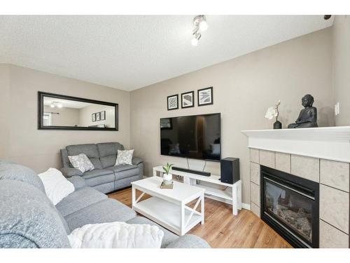 8 Royal Oak Gardens Nw, Calgary, AB - Indoor Photo Showing Living Room With Fireplace