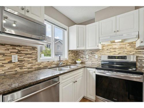 8 Royal Oak Gardens Nw, Calgary, AB - Indoor Photo Showing Kitchen With Double Sink With Upgraded Kitchen