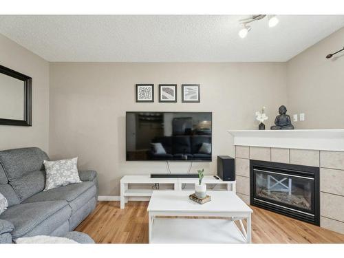 8 Royal Oak Gardens Nw, Calgary, AB - Indoor Photo Showing Living Room With Fireplace