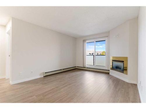 31-1131 Edenwold Heights Nw, Calgary, AB - Indoor With Fireplace