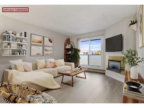 31-1131 Edenwold Heights Nw, Calgary, AB - Indoor Photo Showing Living Room With Fireplace