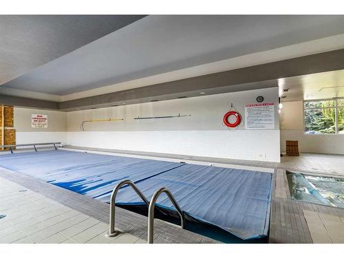 31-1131 Edenwold Heights Nw, Calgary, AB - Indoor Photo Showing Other Room With In Ground Pool