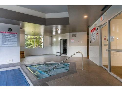 31-1131 Edenwold Heights Nw, Calgary, AB - Indoor Photo Showing Other Room With In Ground Pool