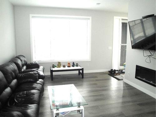 844 Lawthorn Way Se, Airdrie, AB - Indoor Photo Showing Living Room With Fireplace