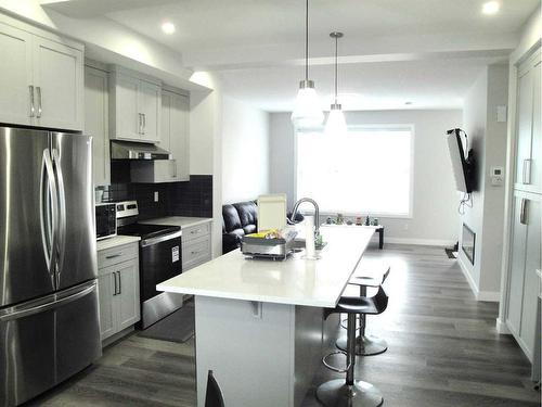 844 Lawthorn Way Se, Airdrie, AB - Indoor Photo Showing Kitchen With Stainless Steel Kitchen With Upgraded Kitchen